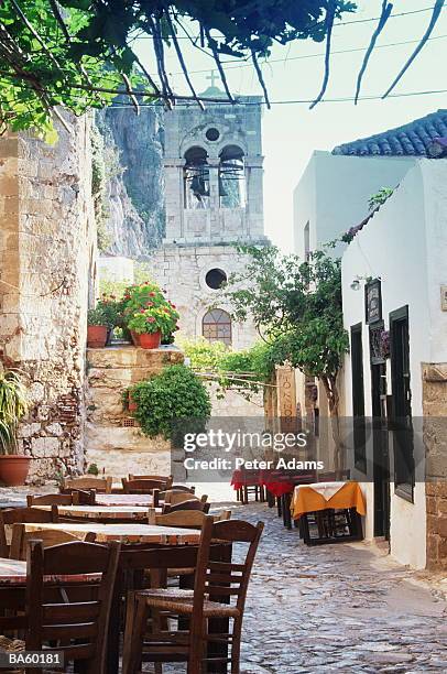 greece, hydra, tables outside restaurant - hydra bildbanksfoton och bilder