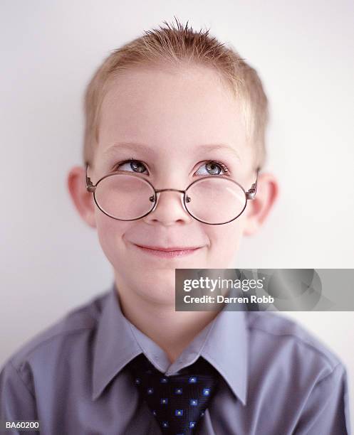 boy (7-9) wearing glasses and tie, close-up - stereotypically upper class stock pictures, royalty-free photos & images