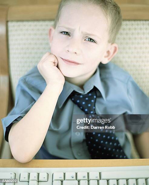 boy (7-9) at computer, close-up, portrait - adult imitation stock pictures, royalty-free photos & images
