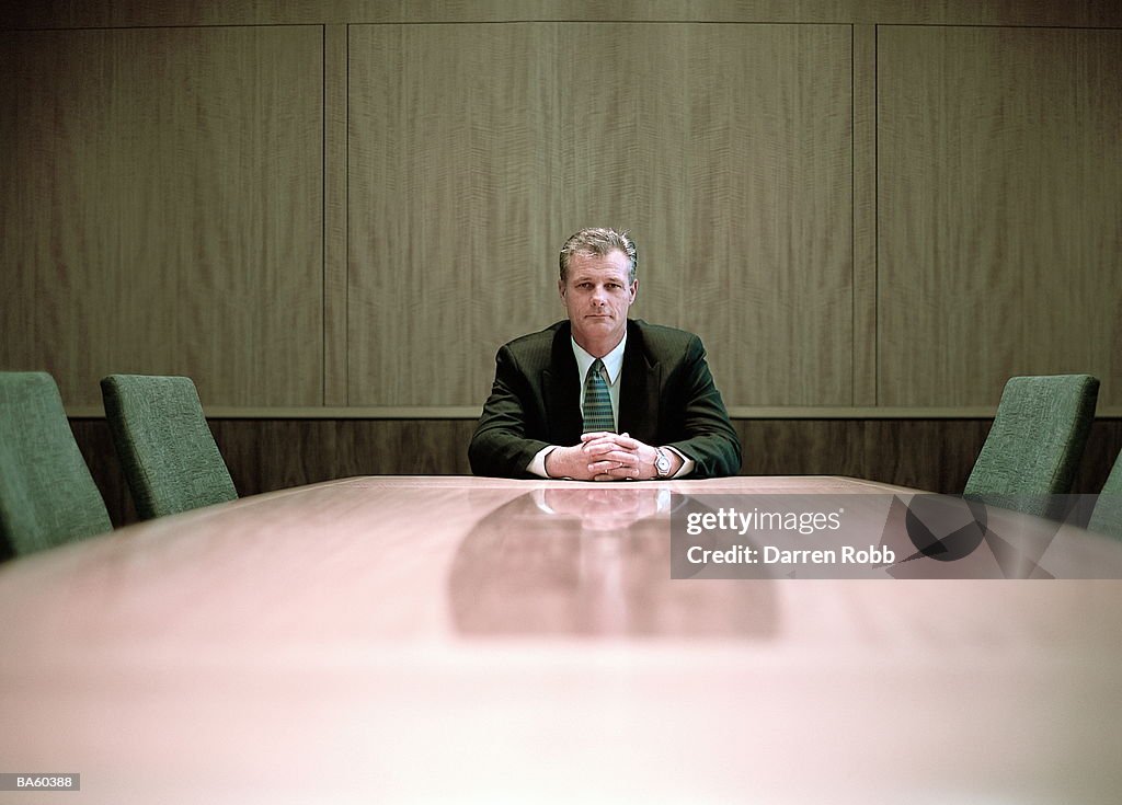 Businessman at conference table, portrait
