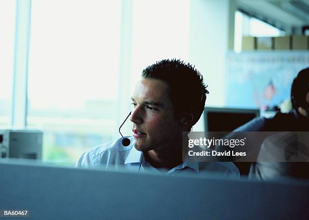 man in office wearing headset - ba60467 bildbanksfoton och bilder