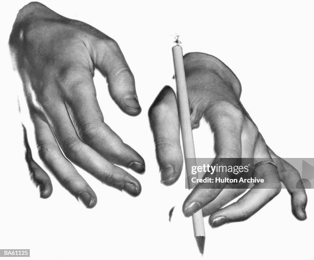 Manicured hands holding pencil