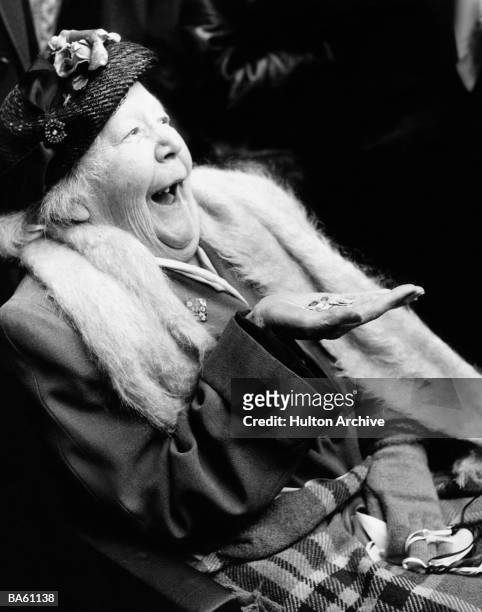 Mrs. Julia Charlotte Talbot, aged 88, of Westminster is highly delighted with the Maundy Money given to her by the Queen. 7th April 1966