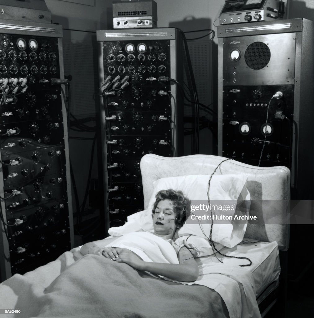Woman sleeping with electrodes on head (B&W)