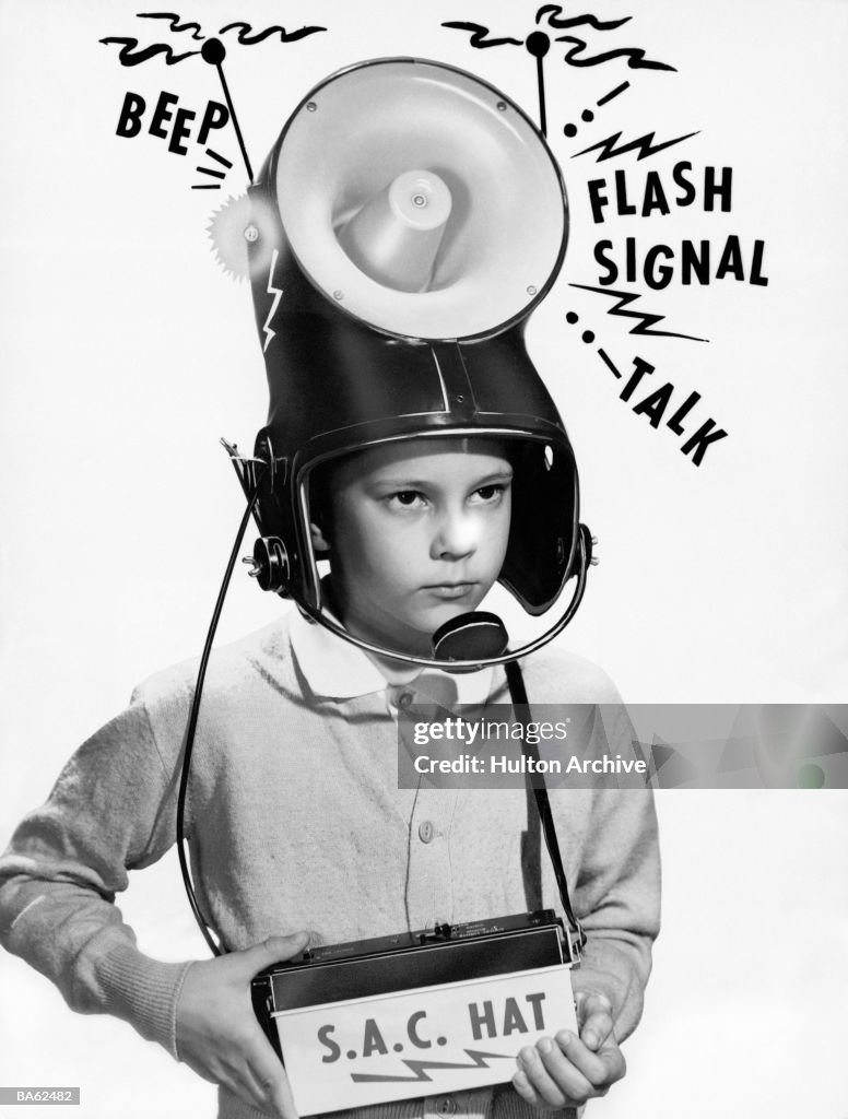 Boy (7-9) wearing 'loudspeaker' helmet (B&W)