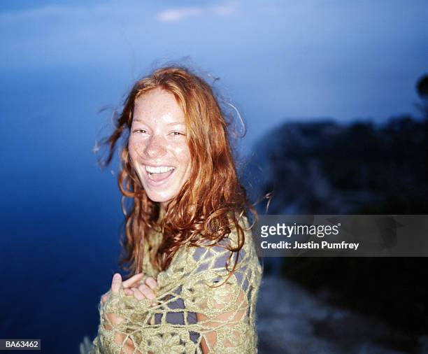 young woman laughing, outdoors, night, portrait - justin stock pictures, royalty-free photos & images