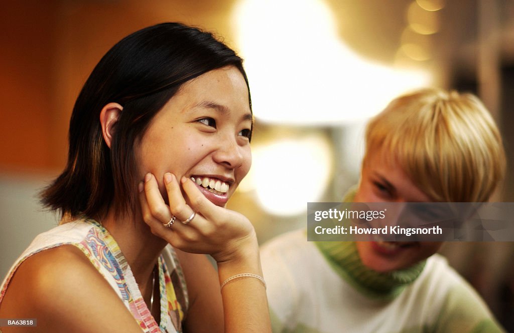 Two young women talking, close-up