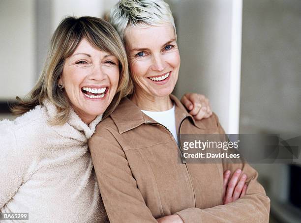 two mature women laughing, portrait, close-up - female friendship stock pictures, royalty-free photos & images