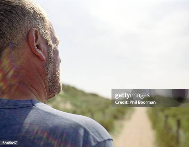 mature man with beard outdoors, rear view, close-up - phil stock pictures, royalty-free photos & images