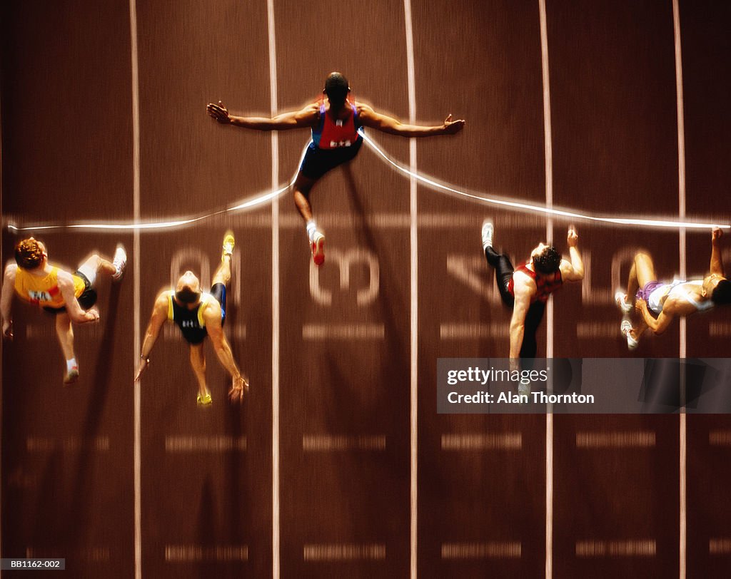 Athletics, runners at finish line, overhead view (Digital Composite)