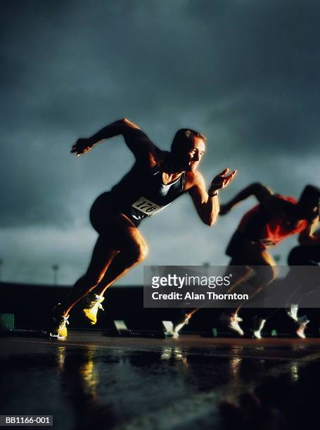 athletes leaving starting-blocks, (digital composite) - all weather running track stock pictures, royalty-free photos & images