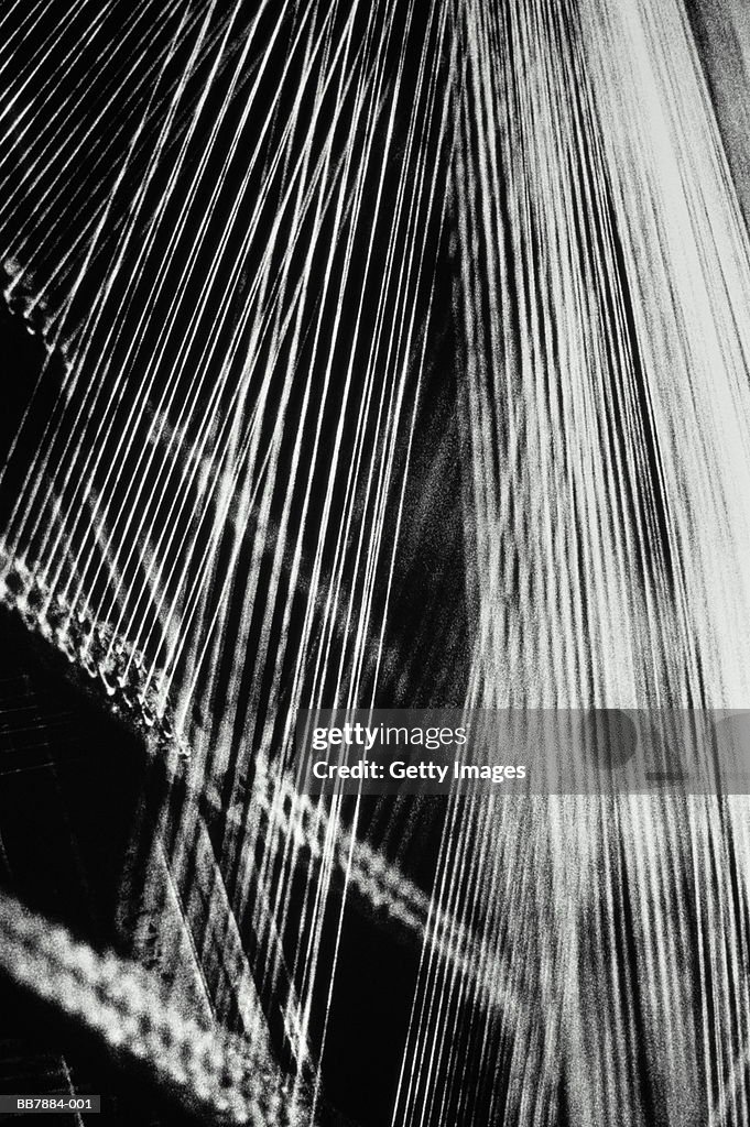 Cotton threads on loom, close-up (B&W)