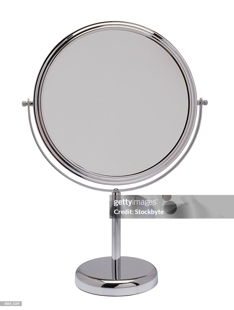 Reversible makeup mirror on stand