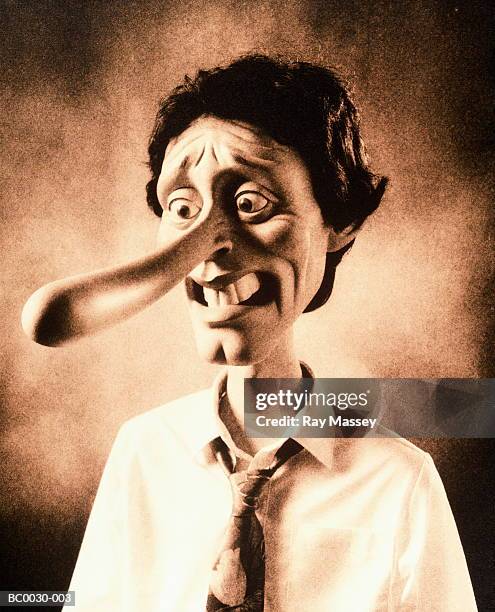 man with 'pinocchio'-style nose (toned b&w) - long nose stock pictures, royalty-free photos & images