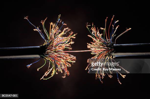 single wire holding together frayed ends of model wiring harness - fragility fracture stock pictures, royalty-free photos & images