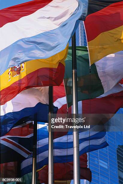european flags, buildings in background - international flags stock-fotos und bilder