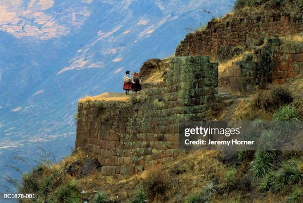 peru,cuzco,urubamba valley,pisac, people walking through inca ruins - urubamba valley stock pictures, royalty-free photos & images