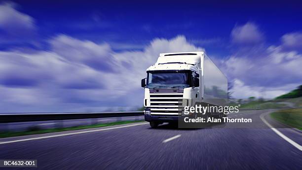 lorry driving on motorway (digital enhancement) - mezzo di trasporto foto e immagini stock