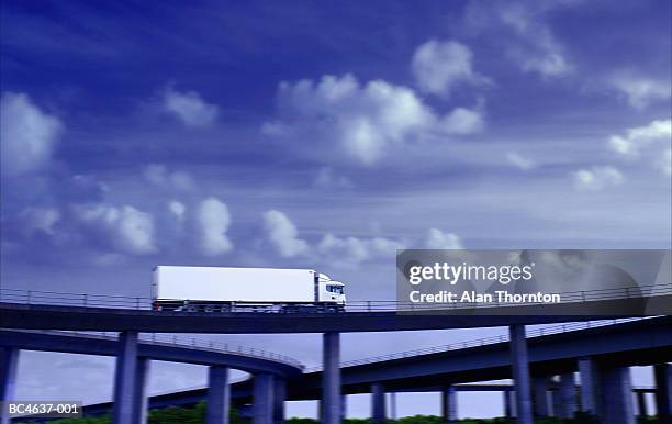 lorry driving on motorway flyover (digital enhancement) - elevated road stock pictures, royalty-free photos & images