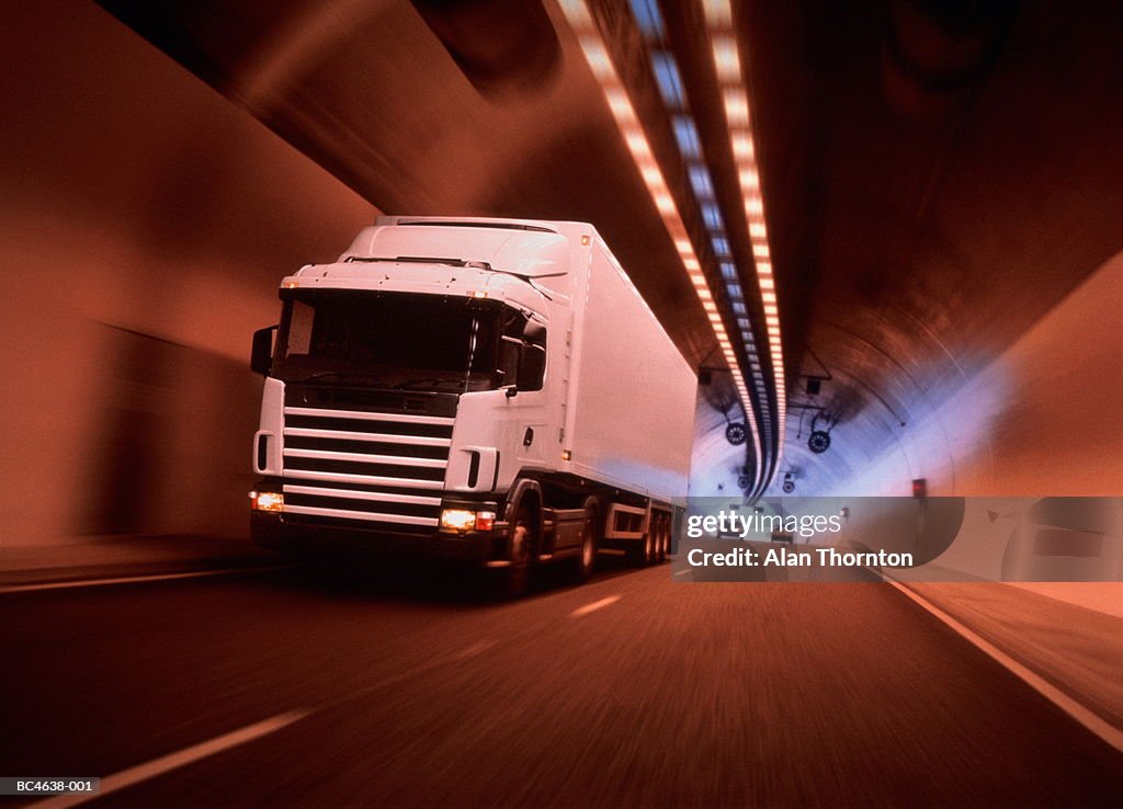 Lorry driving through tunnel, cars in background (Digital Enhancement)