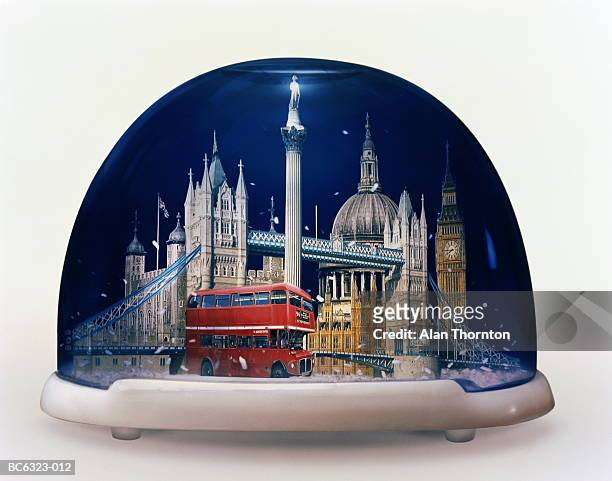 snow globe containing famous sights of london, england (composite) - snow globe stock-fotos und bilder