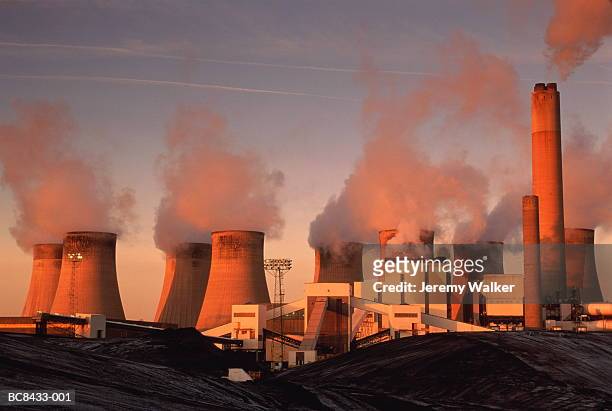 coal fired power station, mounds of coal in foreground, england - coal fired power station stock pictures, royalty-free photos & images