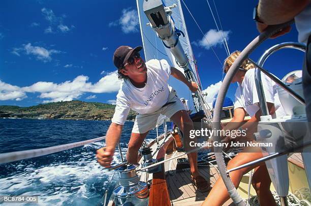 crew working on board yacht, close-up - squadra di vela foto e immagini stock