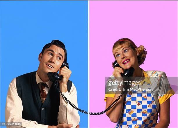 couple with wistful expressions, using telephones (composite) - kitsch - fotografias e filmes do acervo