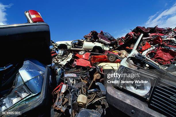 piles of old cars in scrap metal yard, close-up - car yard stock-fotos und bilder
