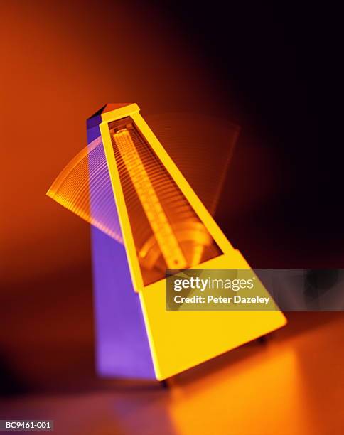 metronome, close-up (brightly lit, long exposure) - metronom stock pictures, royalty-free photos & images