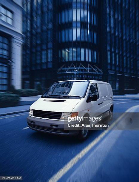 white van on city street (digital enhancement) - nutzfahrzeug stock-fotos und bilder