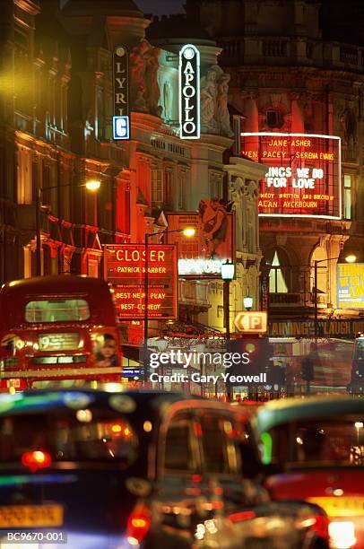 england, london, shaftesbury avenue illuminated at night - london theatre stock pictures, royalty-free photos & images