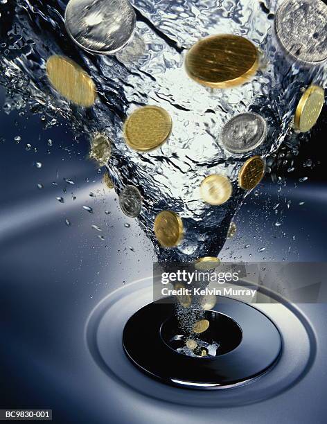 coins going down drain in vortex of water (digital composite) - abfluss stock-fotos und bilder