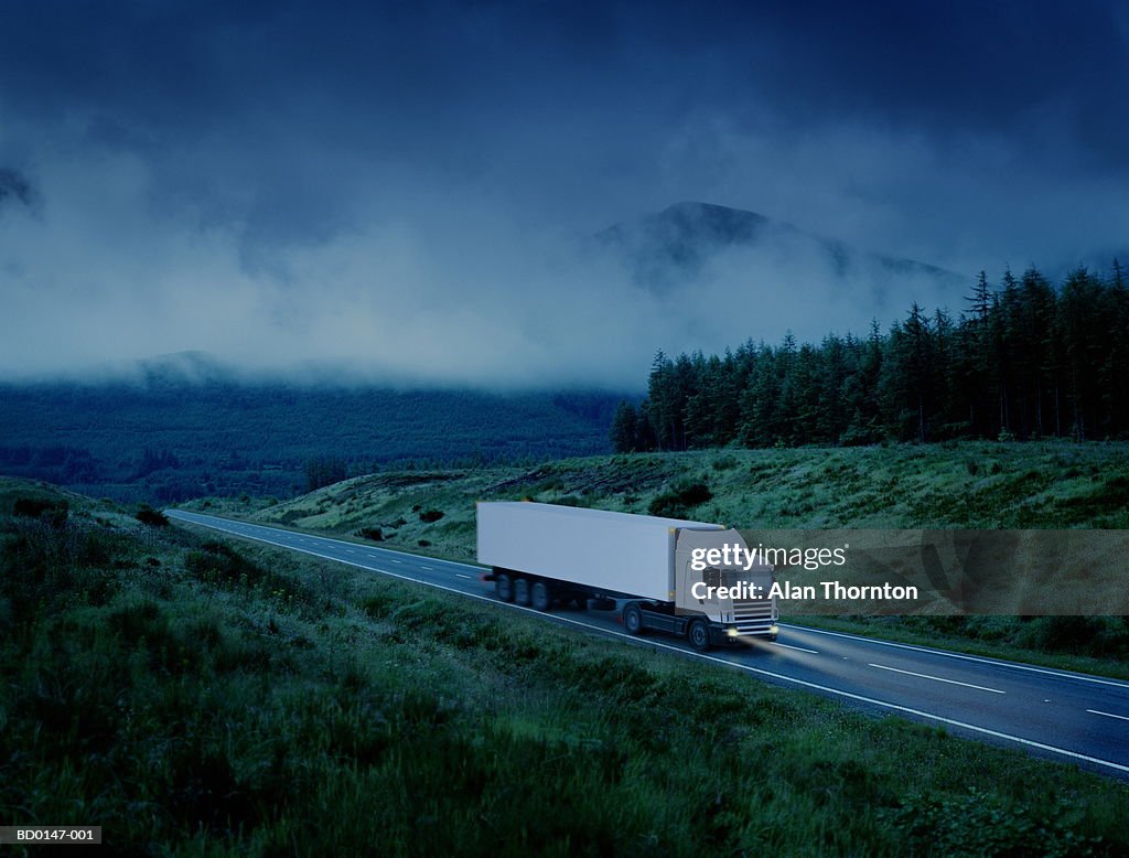 White lorry driving along country road at night (Digital Enhancement)