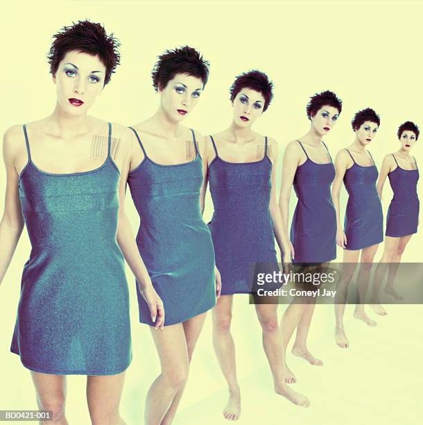 row of 'cloned' young women (digital composite) - multiple images of the same woman stock pictures, royalty-free photos & images