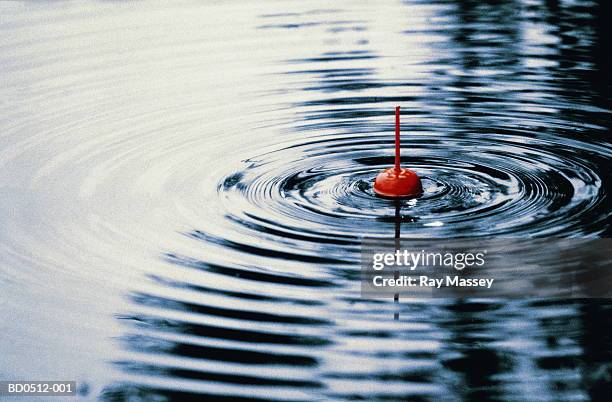 bobbing fishing float, close-up (digital enhancement) - fishing ストックフォトと画像