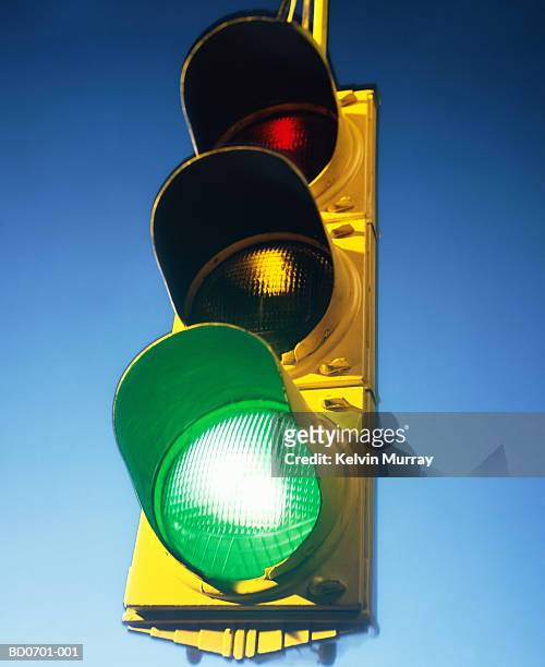 traffic lights, green light illuminated, close-up - go stock pictures, royalty-free photos & images