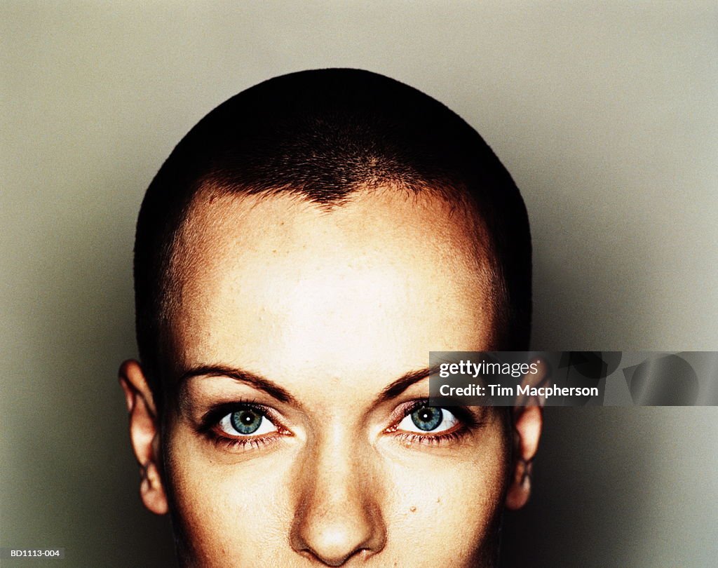 Young woman with cropped hair, section view, portrait