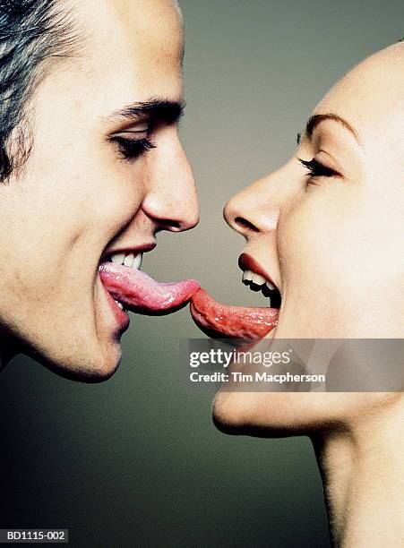 young couple with tongues touching, close-up, profile - man open mouth stock pictures, royalty-free photos & images