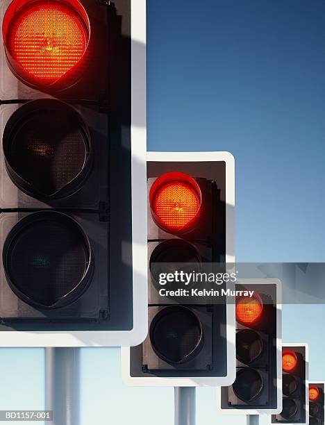 row of traffic lights, red lights illuminated (digital composite) - semáforo vermelho imagens e fotografias de stock