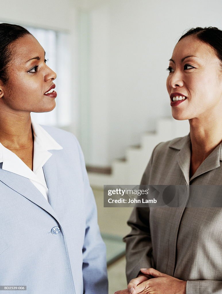 Business executives talking, close-up