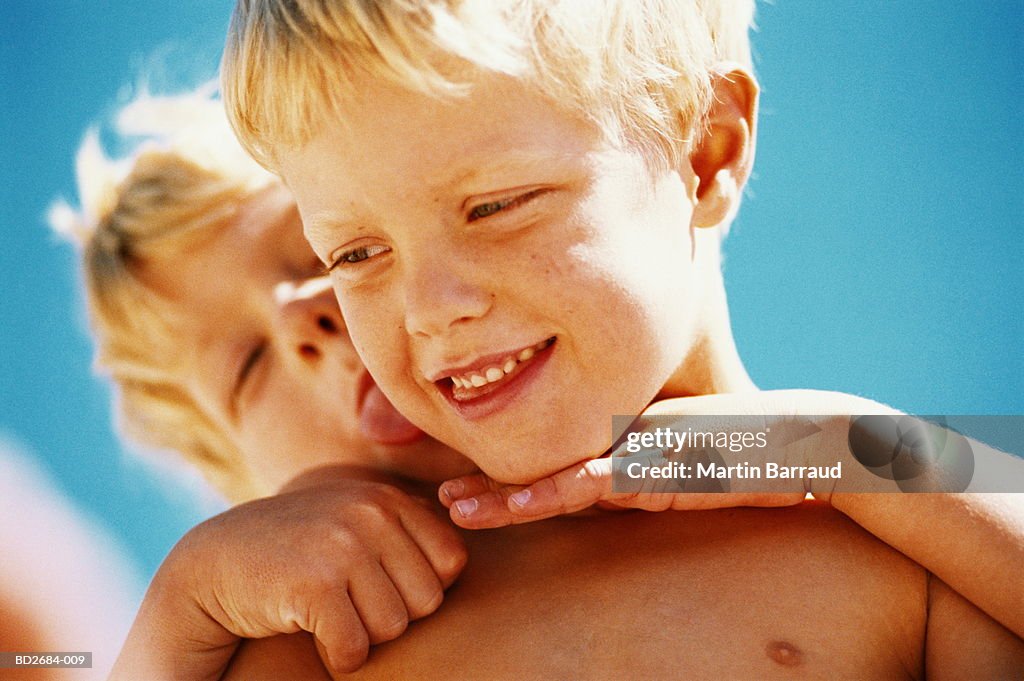 Twin boys (6-8) playing, close-up