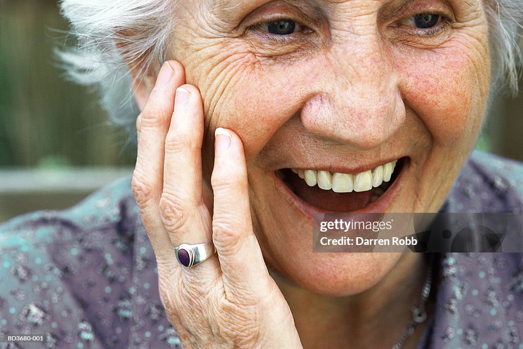 Elderly woman smiling, close-up