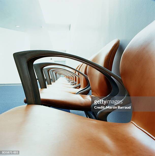 row of chairs along corridor, side view - funky office stock pictures, royalty-free photos & images