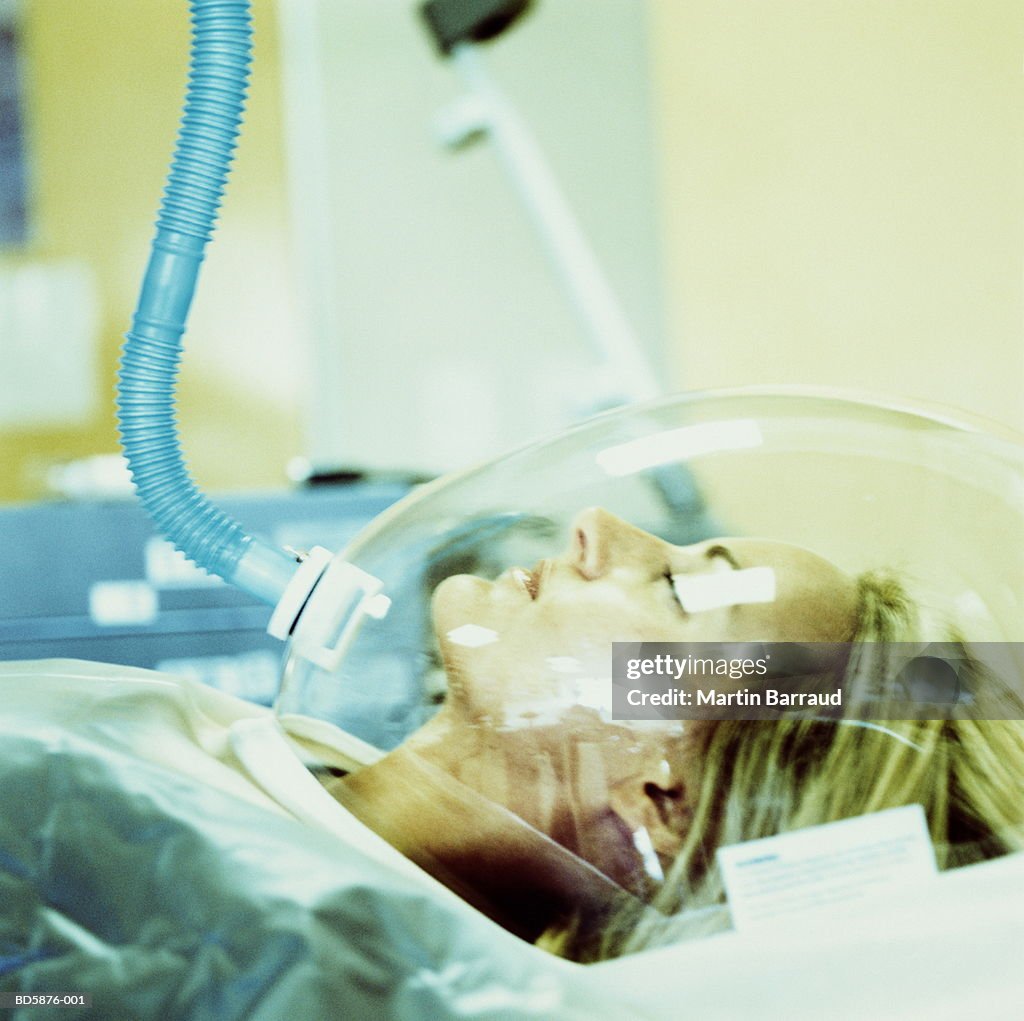 Woman in breathing apparatus