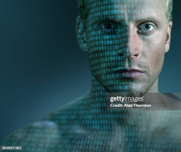 binary code projected onto man's face and chest, close-up - cyborg fotografías e imágenes de stock