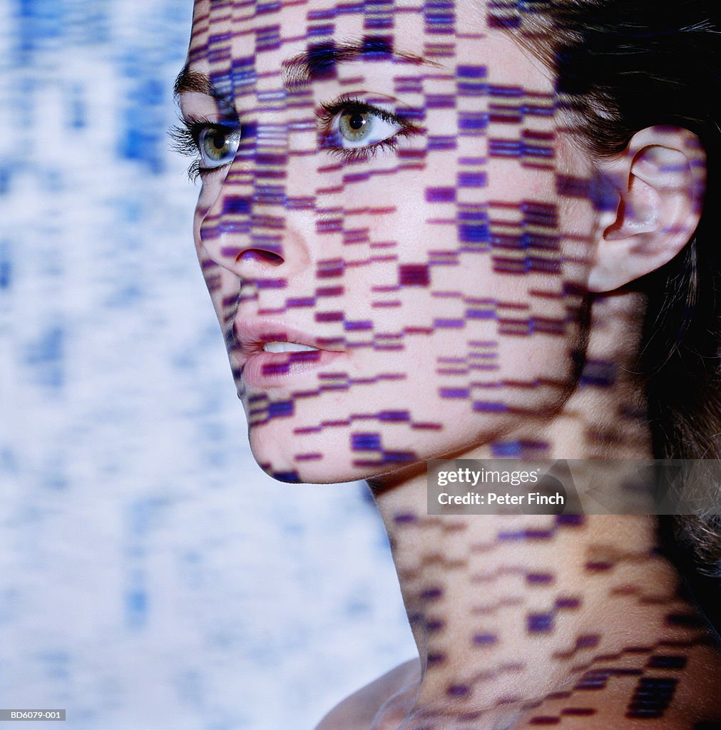 Young woman, DNA gels projected onto face