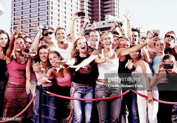 crowd of fans behind rope barrier - adulation ストックフォトと画像