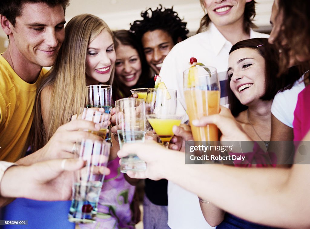 Group of people raising toast