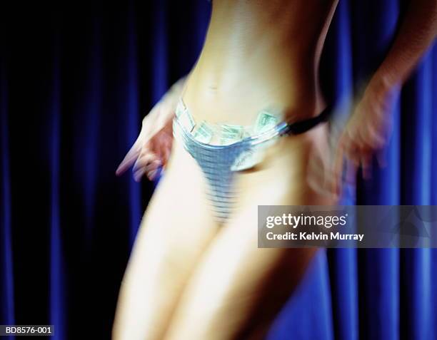 stripper with bank notes tucked in knickers, mid section - knickers photos - fotografias e filmes do acervo